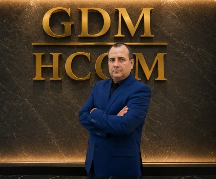 Antonio Bernal, Founder & CEO of GDM High Consulting México, in front of the corporate wall